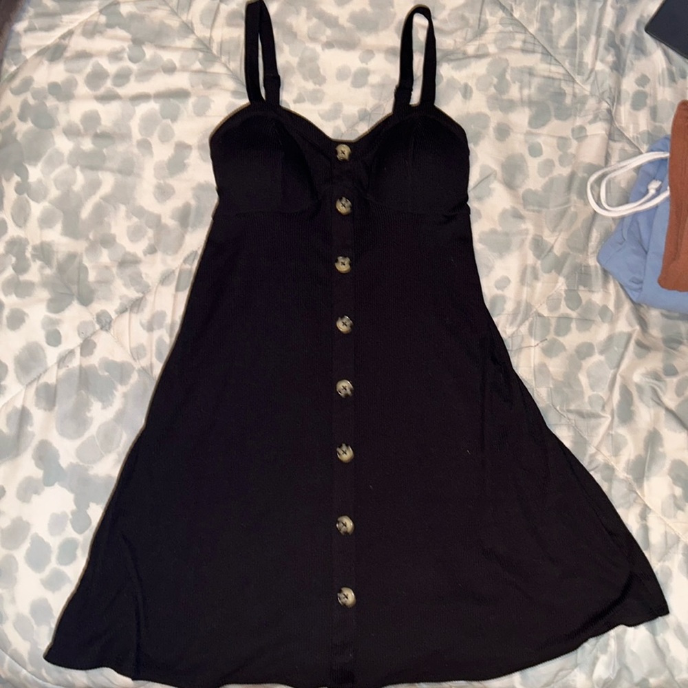 black dress with buttons.